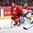 MONTREAL, CANADA - DECEMBER 30: Switzerland's Marco Miranda #11 goes to play the puck while Denmark's Kasper Krog #31 looks on during preliminary round action at the 2017 IIHF World Junior Championship. (Photo by Francois Laplante/HHOF-IIHF Images)

